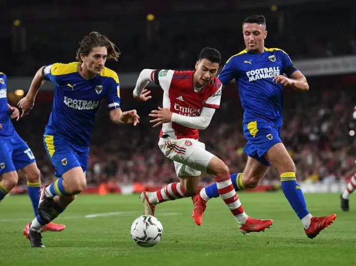 Framed Print : Arsenal's Martinelli Faces Off Against Wimbledon Duo in Carabao Cup Clash