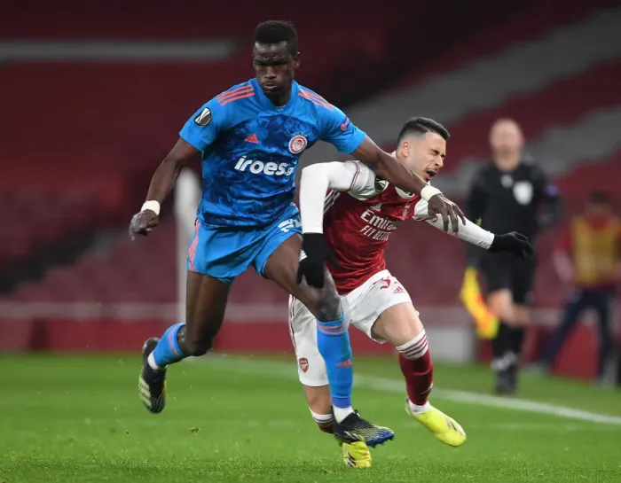 Framed Print : Arsenal's Martinelli Fouls Olympiacos Ba in Empty Europa League Clash (2020-21)
