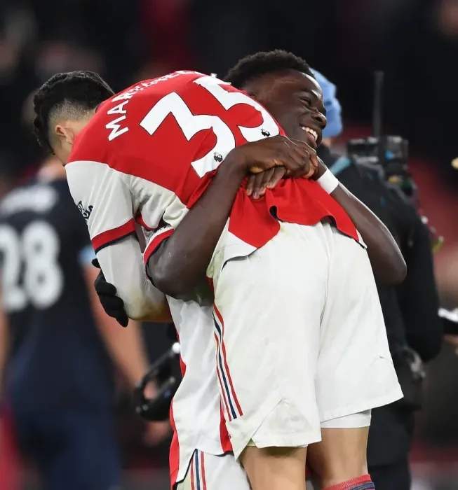 Framed Print : Arsenal's Martinelli and Saka Celebrate Goal: Arsenal v West Ham United, Premier League 2021-22