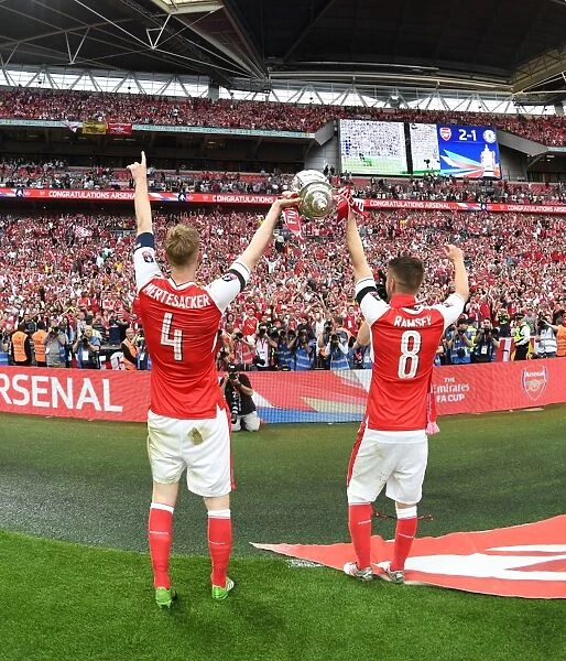 Arsenal's Per Mertesacker and Aaron Ramsey Celebrate FA Cup Victory