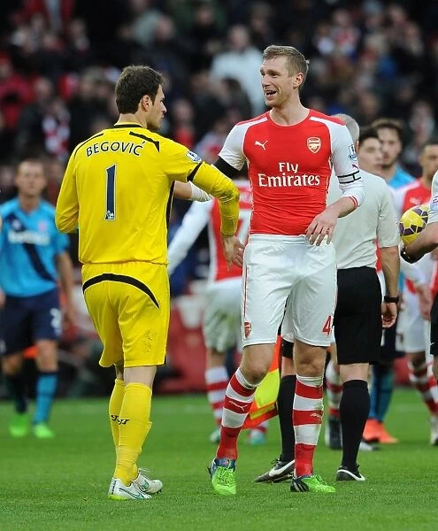 Arsenal's Per Mertesacker and Asmir Begovic Share a Moment After Arsenal v Stoke City Match (2014-15)