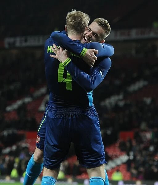 Arsenal's Per Mertesacker and Calum Chambers Celebrate FA Cup Quarterfinal Victory over Manchester United