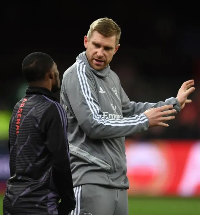 Framed Print : Arsenal's Mertesacker Coaches Maitland-Niles Before Standard Liege Clash (UEFA Europa League, Group F) Framed Print : Arsenal's Mertesacker Coaches Maitland-Niles Before Standard Liege Clash (UEFA Europa League, Group F)