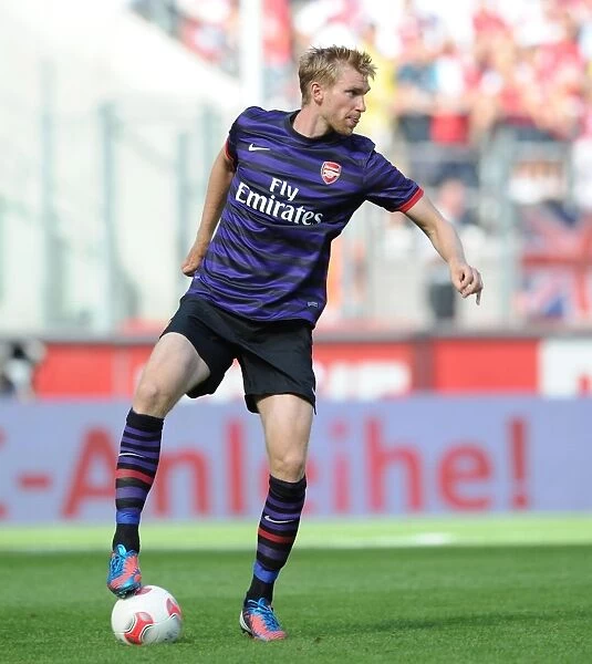 Arsenal's Per Mertesacker Faces Off Against FC Cologne in 2012 Pre-Season Friendly