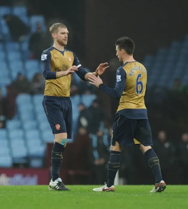 Framed Print : Arsenal's Per Mertesacker and Laurent Koscielny Share a Heartfelt Moment After Aston Villa Match, 2015-16 Premier League