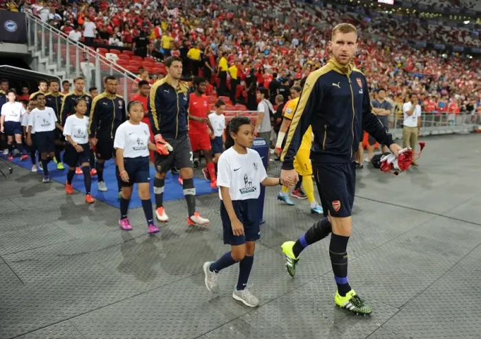 Framed Print : Arsenal's Per Mertesacker Leads Team Out in Arsenal v Singapore XI Match, Kallang, Singapore (July 15, 2015)