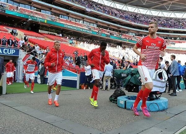 Arsenal's Per Mertesacker Leads Team Out in FA Cup Semi-Final vs. Reading at Wembley Stadium