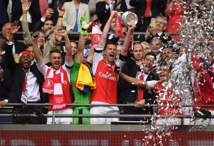 Framed Print : Arsenal's Per Mertesacker Lifts FA Cup after Arsenal v Chelsea Final Victory Framed Print : Arsenal's Per Mertesacker Lifts FA Cup after Arsenal v Chelsea Final Victory