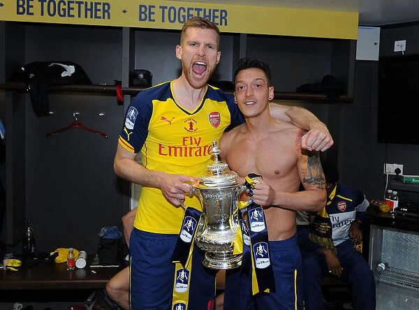 Arsenal's Per Mertesacker and Mesut Ozil Celebrate FA Cup Victory