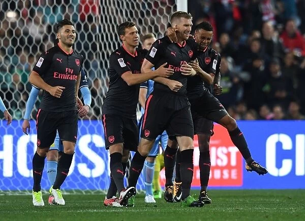 Arsenal's Per Mertesacker Nets Goal, Celebrates with Kolasinac, Bielik, and Coquelin