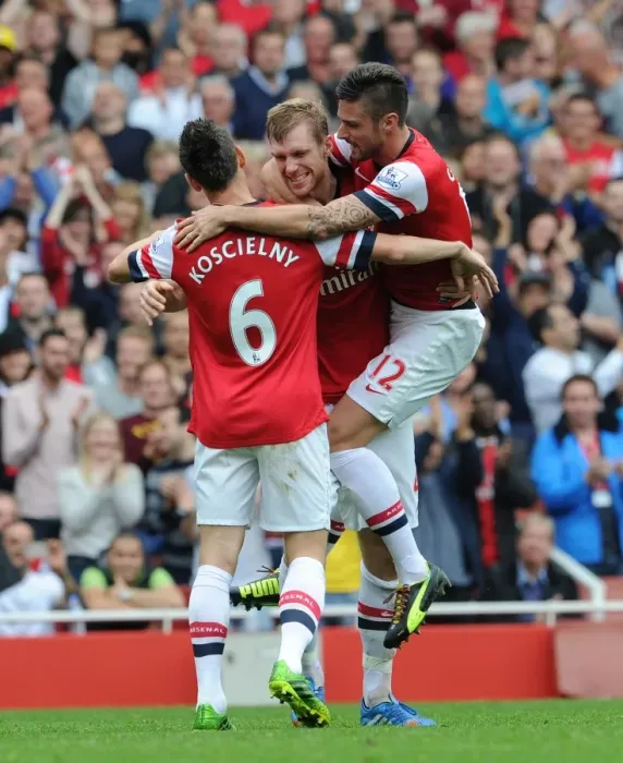 Framed Print : Arsenal's Per Mertesacker, Olivier Giroud, and Laurent Koscielny Celebrate Goals Against Stoke City (2013-14)
