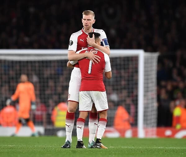 Arsenal's Mertesacker and Sanchez in Action: A Europa League Battle against 1. FC Koeln, 2017-18