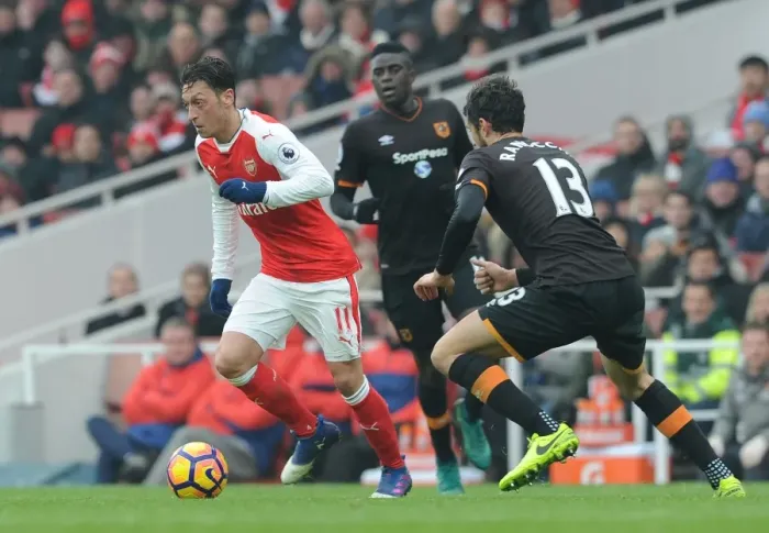 Framed Print : Arsenal's Mesut Ozil Faces Off Against Hull City's Andrea Ranocchia in Premier League Clash Framed Print : Arsenal's Mesut Ozil Faces Off Against Hull City's Andrea Ranocchia in Premier League Clash
