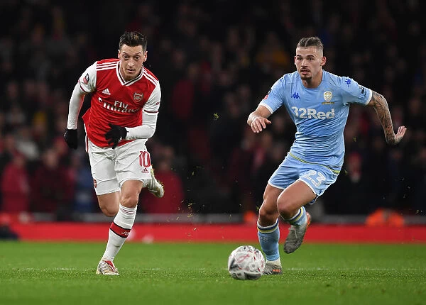 Arsenal's Mesut Ozil Outmaneuvers Leeds Kalvin Phillips in FA Cup Clash