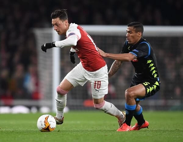 Arsenal's Mesut Ozil Outmaneuvers Napoli's Allan in Europa League Quarterfinal Clash