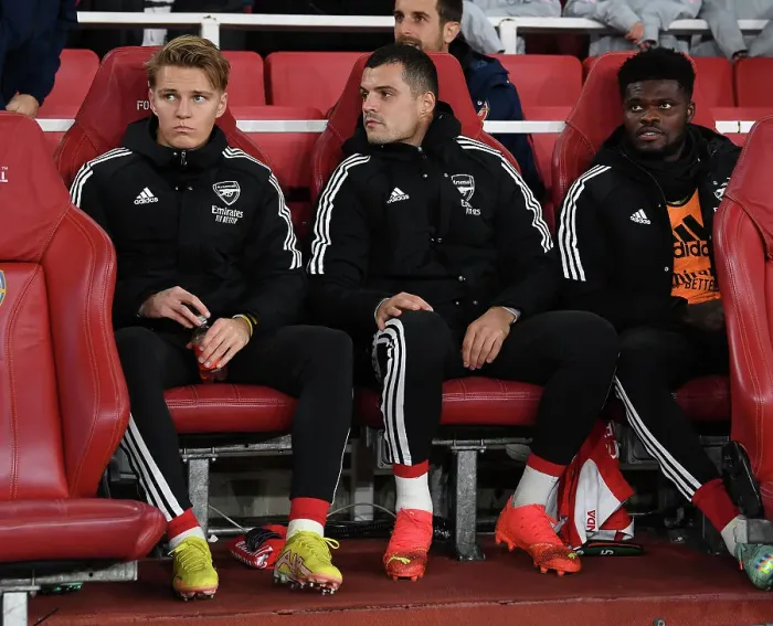 Framed Print : Arsenal's Midfield Trio: Odegaard, Xhaka, Partey on the Bench for Carabao Cup Match vs. Brighton