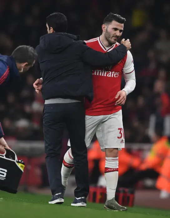 Framed Print : Arsenal's Mike Arteta Embraces Sead Kolasinac After Substitution vs Manchester United (Premier League, 2019-20) Framed Print : Arsenal's Mike Arteta Embraces Sead Kolasinac After Substitution vs Manchester United (Premier League, 2019-20)