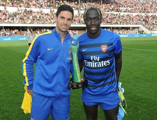 Arsenal's Mikel Arteta and Bacary Sagna: Post-Match Reunion Against Manchester City (2013)