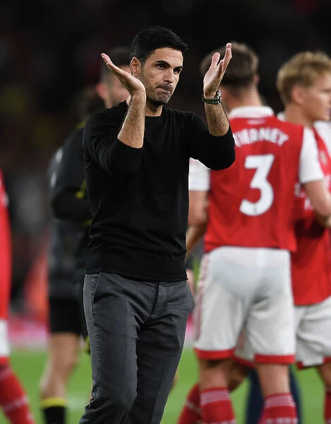 Arsenal's Mikel Arteta Celebrates with Fans after Victory over Aston Villa