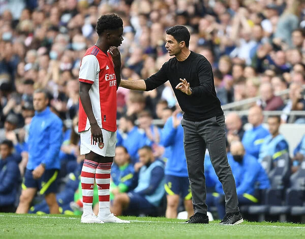 Arsenal's Mikel Arteta Coaches Bukayo Saka at Arsenal-Tottenham Pre-Season Training