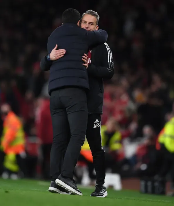 Framed Print : Arsenal's Mikel Arteta Embraces Assistant Coach Albert Stuivenburg After Arsenal v West Ham United Win Framed Print : Arsenal's Mikel Arteta Embraces Assistant Coach Albert Stuivenburg After Arsenal v West Ham United Win