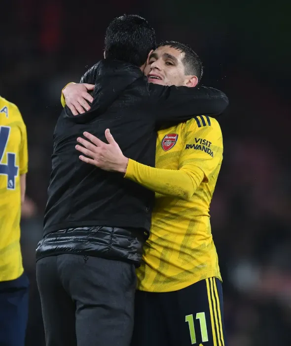 Framed Print : Arsenal's Mikel Arteta Embraces Lucas Torreira Amidst AFC Bournemouth Clash (2019-20) Framed Print : Arsenal's Mikel Arteta Embraces Lucas Torreira Amidst AFC Bournemouth Clash (2019-20)