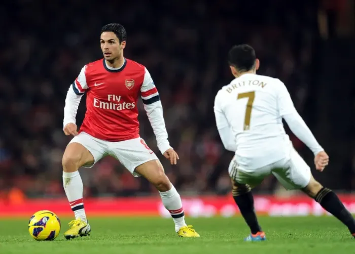 Framed Print : Arsenal's Mikel Arteta Fends Off Swansea's Leon Britton in 2012-13 Premier League Clash Framed Print : Arsenal's Mikel Arteta Fends Off Swansea's Leon Britton in 2012-13 Premier League Clash