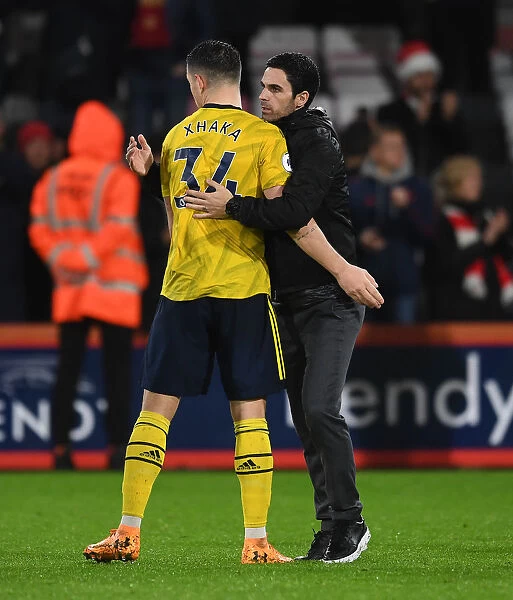Arsenal's Mikel Arteta and Granit Xhaka Celebrate Victory over AFC Bournemouth (December 2019)