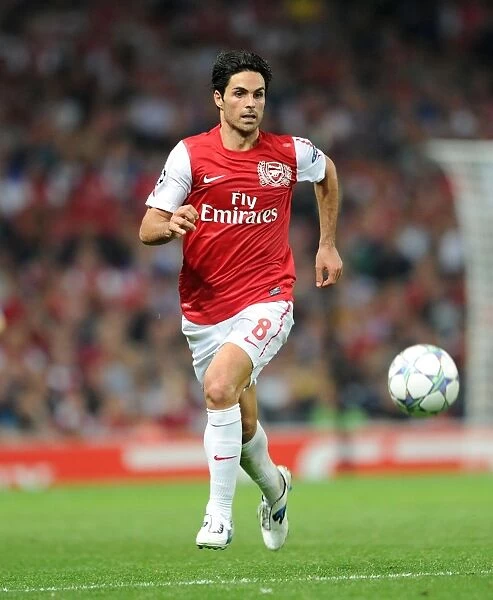 Arsenal's Mikel Arteta Leads 2:1 Victory Over Olympiacos in UEFA Champions League Group F at Emirates Stadium (2011-12)