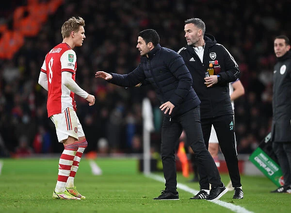 Arsenal's Mikel Arteta and Martin Odegaard Strategize Tactics During Carabao Cup Semi-Final vs Liverpool