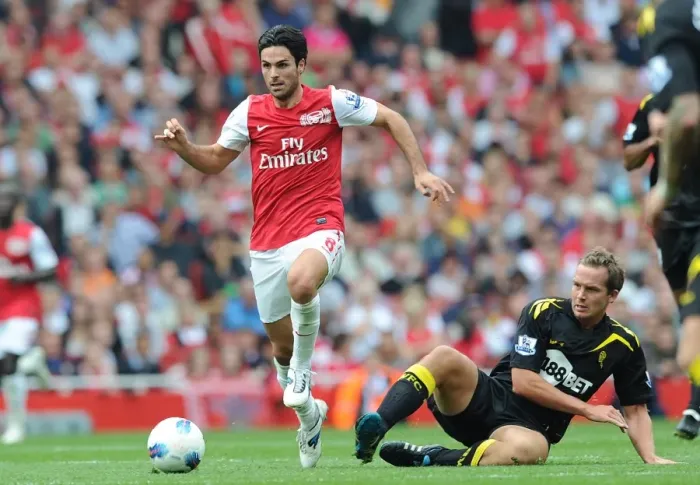 Framed Print : Arsenal's Mikel Arteta Outmaneuvers Bolton's Kevin Davies in 2011-12 Premier League Clash Framed Print : Arsenal's Mikel Arteta Outmaneuvers Bolton's Kevin Davies in 2011-12 Premier League Clash