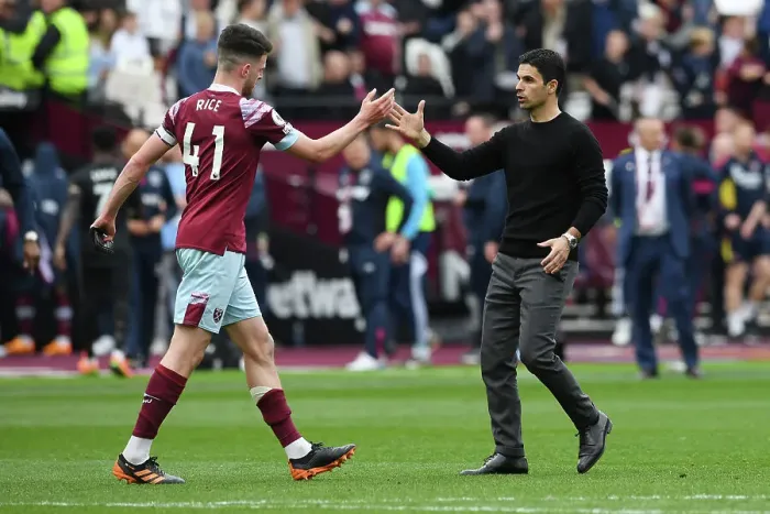 Framed Print : Arsenal's Mikel Arteta and West Ham's Declan Rice Share a Moment After London Derby