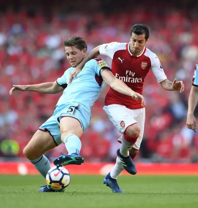 Framed Print : Arsenal's Mkhitaryan Clashes with Burnley's Tarkowski in Intense Premier League Showdown