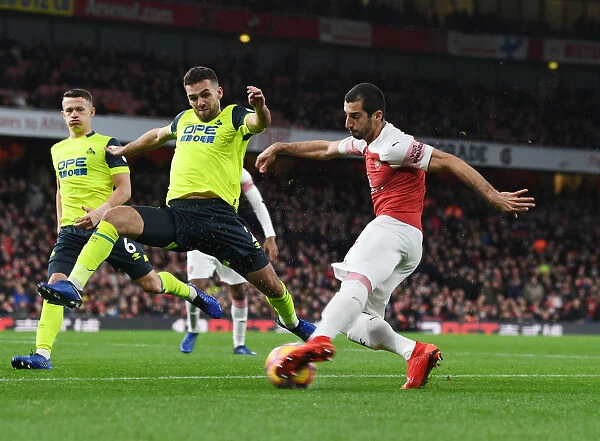 Arsenal's Mkhitaryan Clashes with Huddersfield's Smith in Premier League Showdown