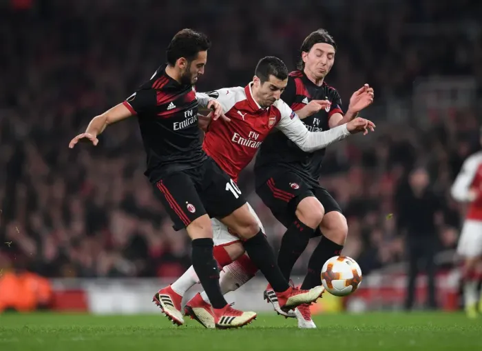 Framed Print : Arsenal's Mkhitaryan Faces Off Against Calhanoglu and Montolivo in Intense Europa League Clash