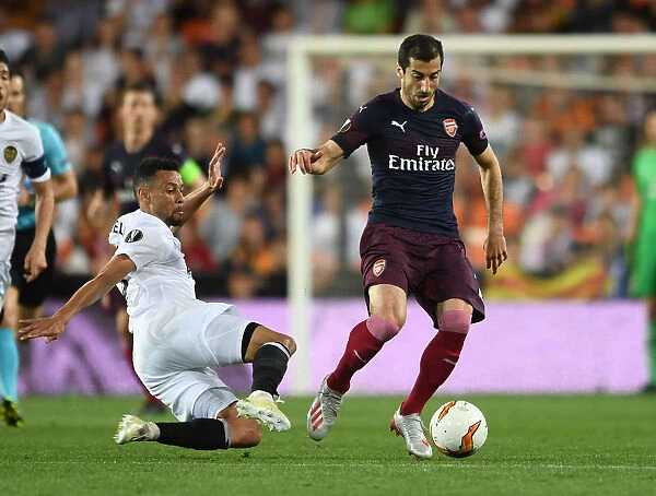 Arsenal's Mkhitaryan Faces Off Against Coquelin in UEFA Europa League Semi-Final Showdown (Valencia vs Arsenal, 2018-19)