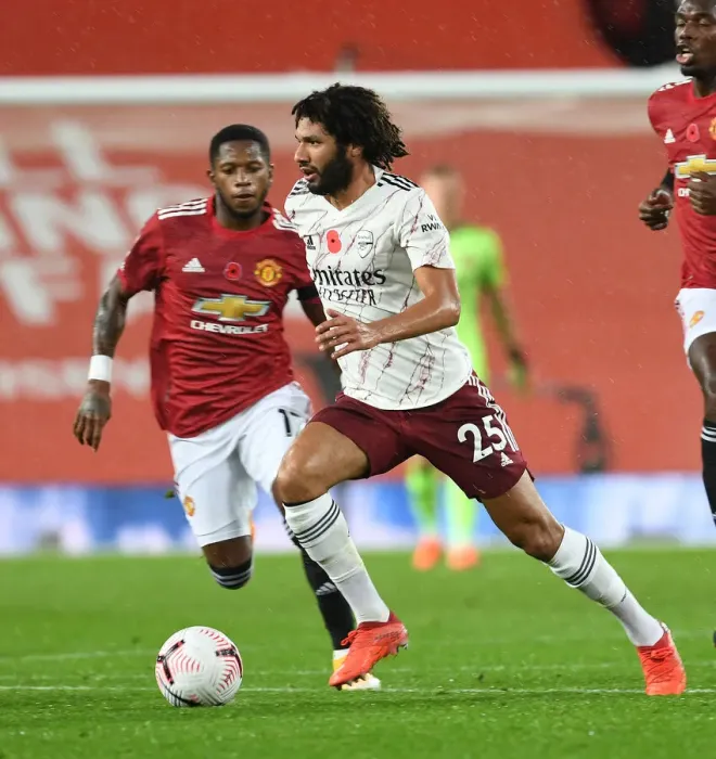 Framed Print : Arsenal's Mo Elneny at Manchester United: Premier League Clash Amidst Empty Stands (2020-21) Framed Print : Arsenal's Mo Elneny at Manchester United: Premier League Clash Amidst Empty Stands (2020-21)