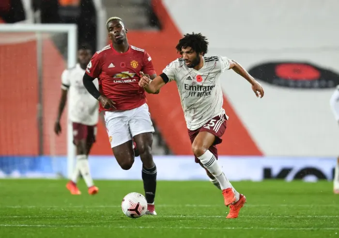 Framed Print : Arsenal's Mo Elneny Outmaneuvers Manchester United's Pogba in Empty Old Trafford Framed Print : Arsenal's Mo Elneny Outmaneuvers Manchester United's Pogba in Empty Old Trafford