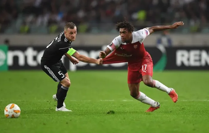 Framed Print : Arsenal's Mohamed Elneny Faces Off Against Qarabag's Mikael in Europa League Clash