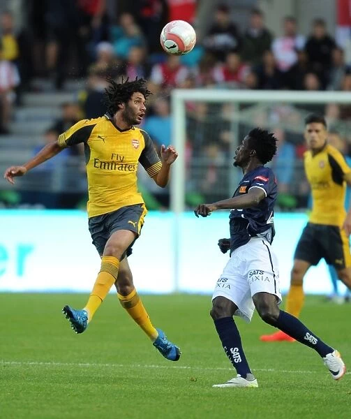 Arsenal's Mohamed Elneny Leaps Over Viking's Usman Sali in 2016 Pre-Season Showdown