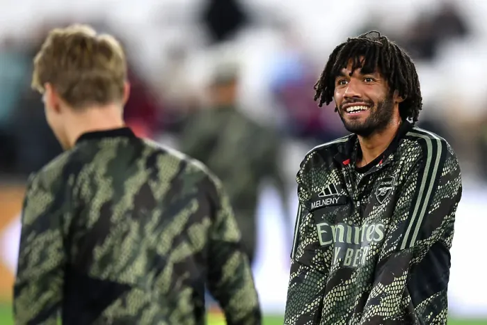 Framed Print : Arsenal's Mohamed Elneny Warming Up Ahead of West Ham Showdown - Carabao Cup 2023-24