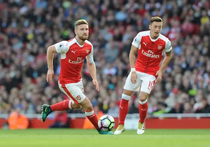 Framed Print : Arsenal's Mustafi and Ozil: A Premier League Showdown - Arsenal vs Swansea City (2016-17)