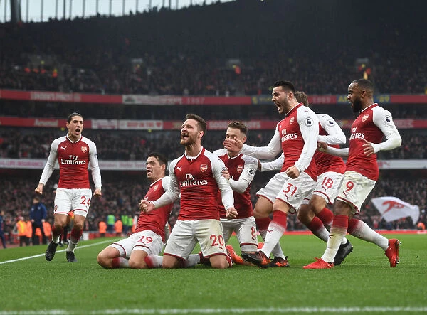 Arsenal's Mustafi, Ramsey, Kolasinac, and Lacazette Celebrate Goal Against Tottenham (2017-18)