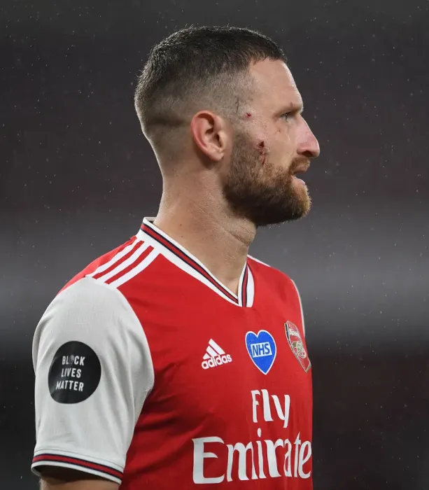 Framed Print : Arsenal's Mustafi Suffers Facial Injury in Arsenal vs. Leicester City Clash (2019-20)