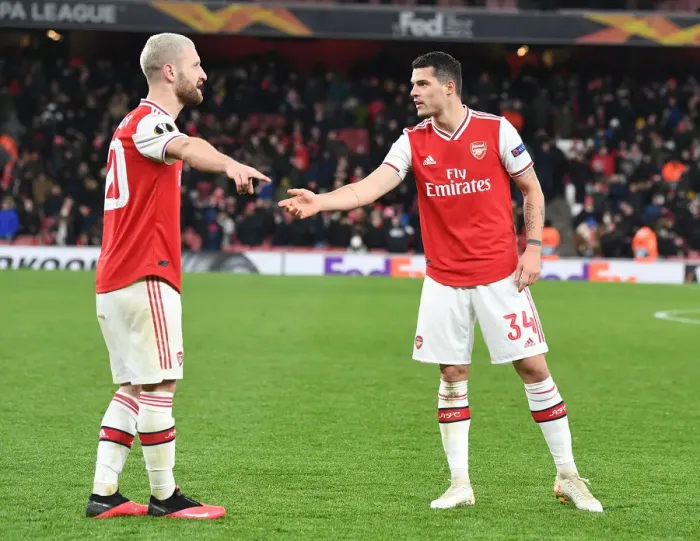 Framed Print : Arsenal's Mustafi and Xhaka Clash in Europa League Battle Against Olympiacos