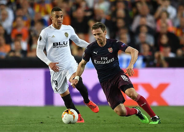 Arsenal's Nacho Monreal Faces Off Against Valencia's Rodrigo in Europa League Semi-Final Showdown