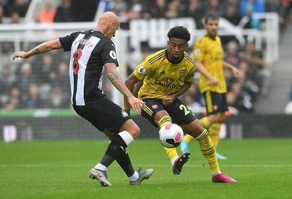 Arsenal's Nelson Faces Shelvey Pressure in Newcastle Clash (Premier League 2019-20)