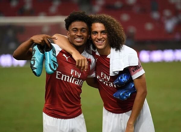 Arsenal's Nelson and Guendouzi: Celebrating Victory after Arsenal vs Atletico Madrid, 2018 International Champions Cup