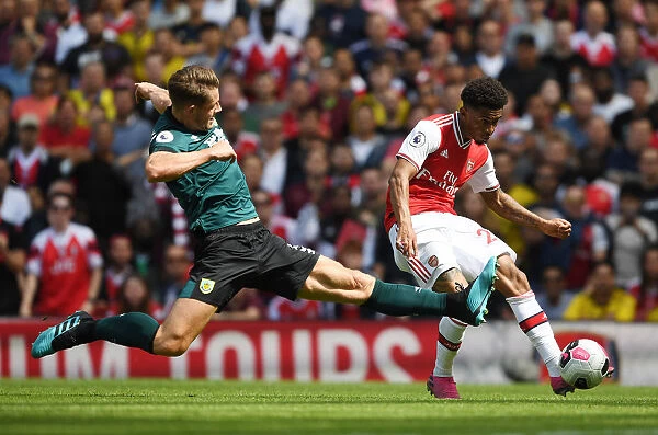 Arsenal's Nelson Takes on Tarkowski in Intense Arsenal v Burnley Clash (2019-20)