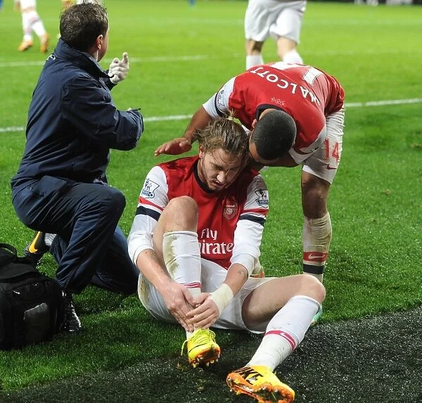 Arsenal's Nicklas Bendtner Celebrates Goal and Injury with Theo Walcott and Colin Lewin (Arsenal v Cardiff City, 2014)